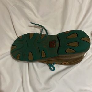 Twisted X size is 5.5 brown leather  with teal accents